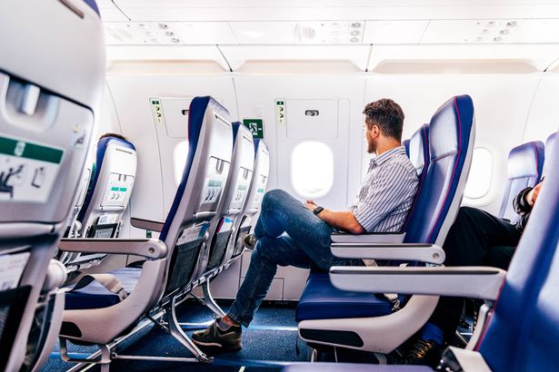 Tall man on plane