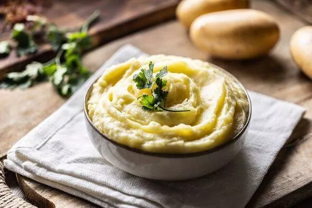 Mashed potatoes in white bowl