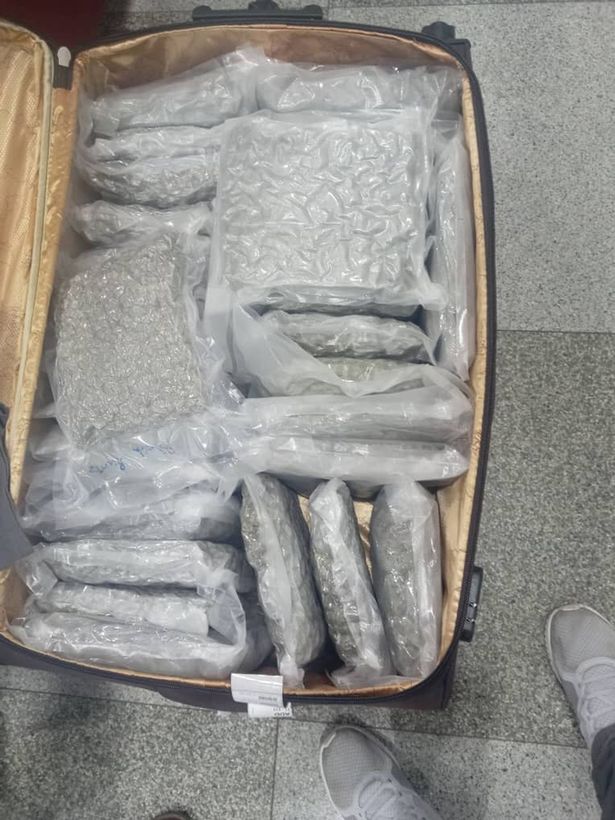 A total of 53 packets of cannabis were discovered in the pair's red and brown tagged luggage, prosecutors said