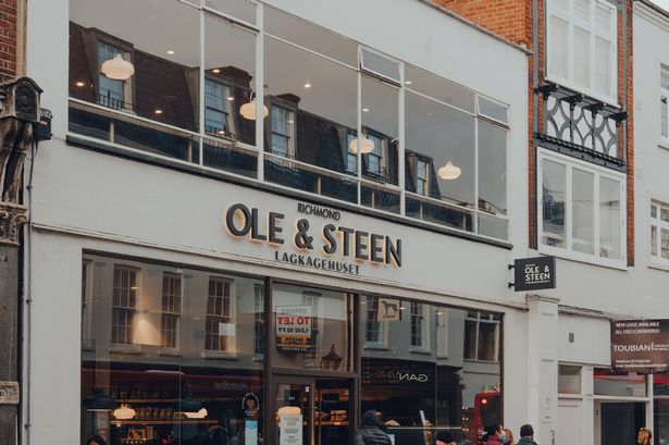 London, UK - October 10, 2020: People queue outside Ole and Steen cafe in Richmond, a suburban town in south-west London famous for large number of parks.