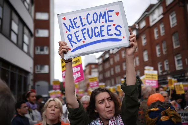 Counter protesters from Stand Up To Racism gather outside the Barbican Thistle Hotel housing migrants on August 2, 2025 in London,
