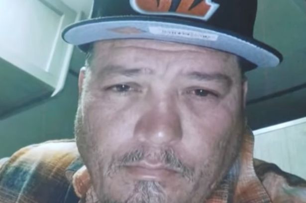 Ronald Andrew Baquera faces camera in selfie