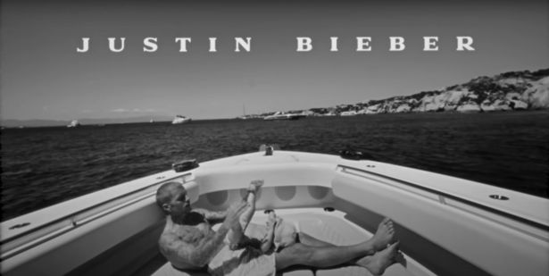 Justin Bieber with his baby on a boat