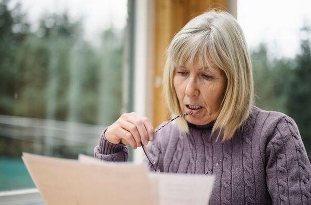 Senior woman with financial problems
