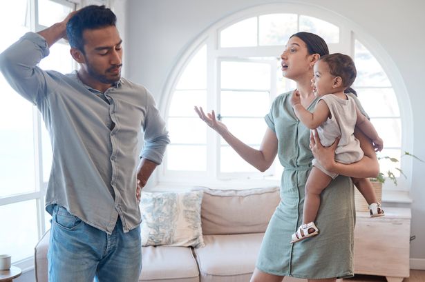 Arguing couple with baby