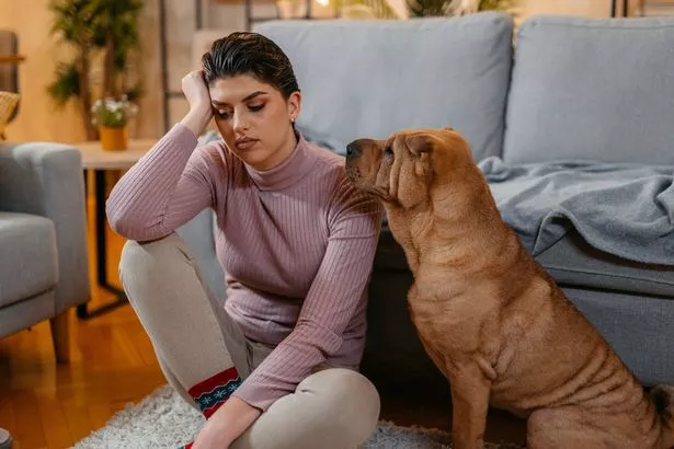 Sad woman with dog