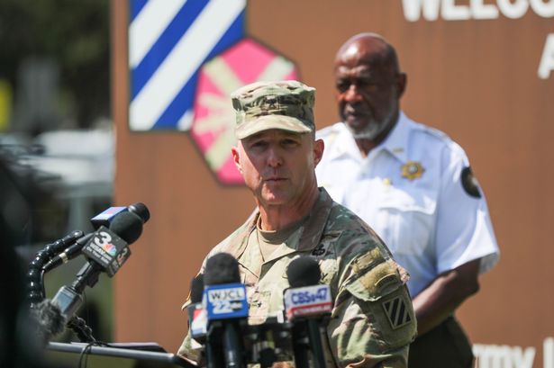 Brig. Gen. John Lubas speaking at a press conference following the shooting