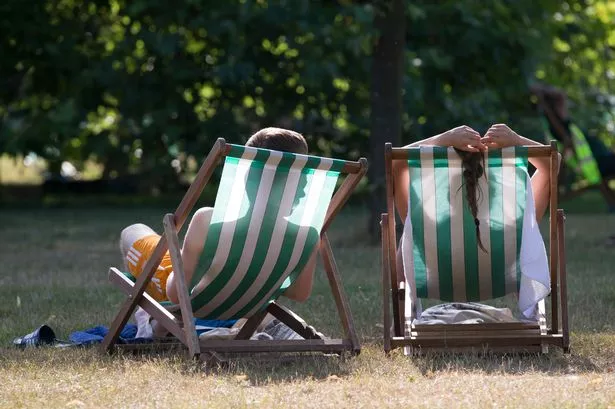 People enjoying the sunshine in a park