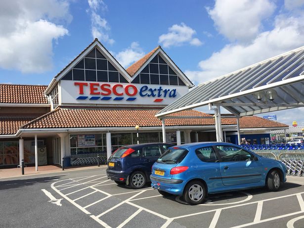 Llanelli, UK: June 14, 2018: Main entrance to a Tesco Extra superstore. Disabled parking spaces give easy access to the store. Tesco is the UK's largest supermarket chain.