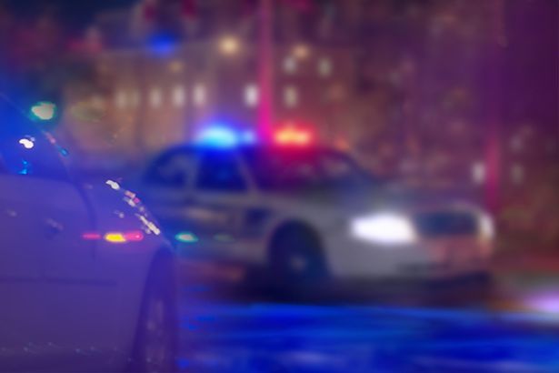 US police car at night. (stock)