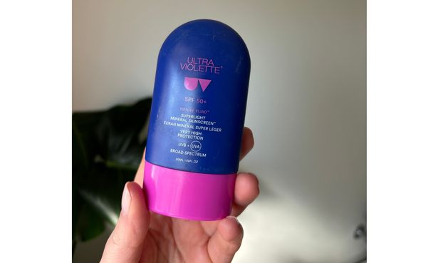 Laura holding Ultra Violette Future Fluid SPF50+ Superlight Mineral Skinscreen