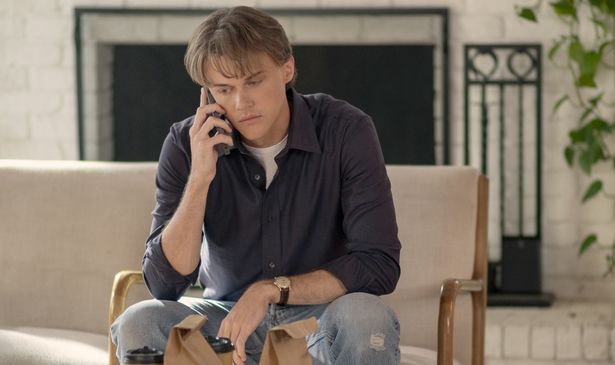 A young man talks on the phone