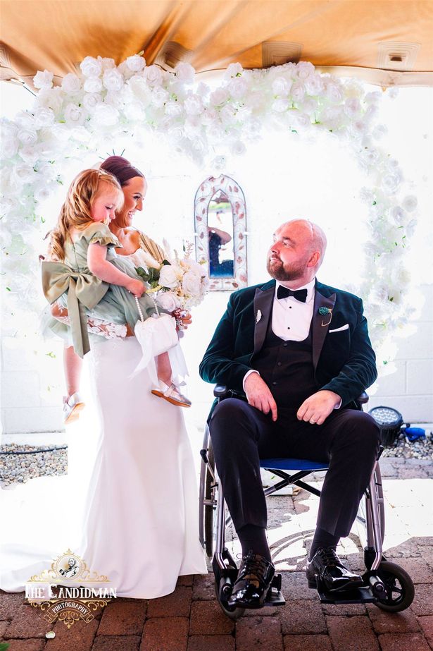 Michaela and Dean on their wedding day with their daughter Sloane