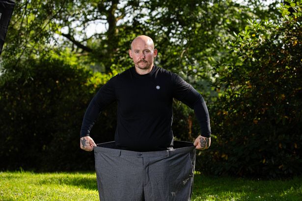 Dale Forrest with the suit trousers he wore at his wedding