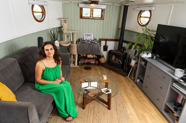 Lucy Barwick inside her boat home