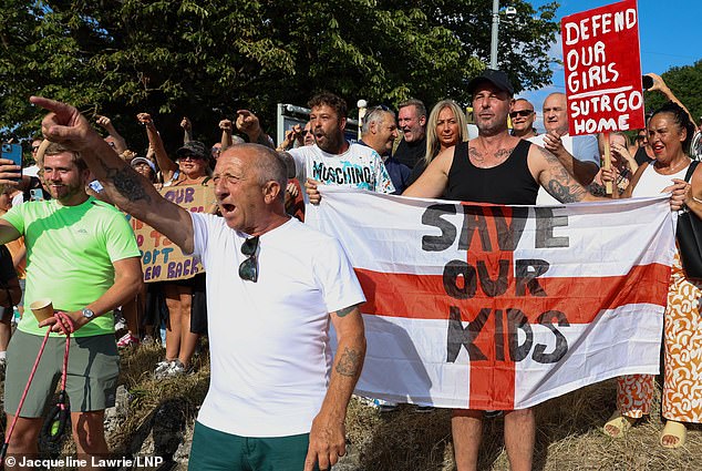 Fierce protests have erupted over alleged foreign criminals, living in migrant hotels, carrying out sex attacks while in Britain (pictured are protesters in Epping, Essex, after a migrant allegedly sexually assaulted two teenage girls in the town days after arriving illegally in Britain)