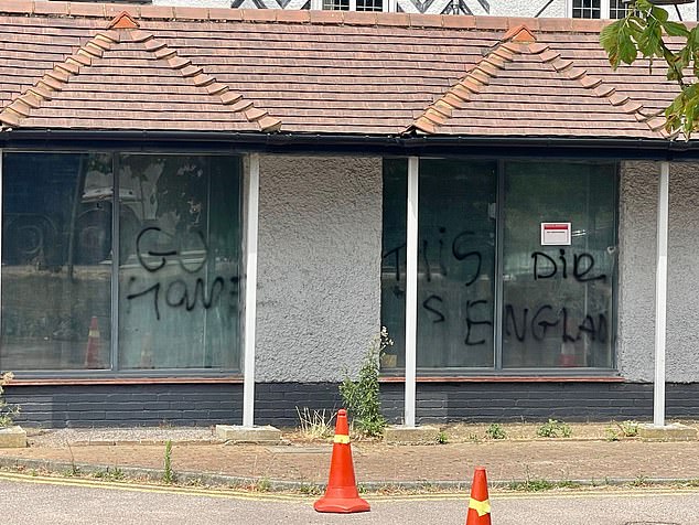 Pictured: The Bell Hotel where Kebatu had been staying at the time of the incidents. Following protests last month, the hotel was graffitied with slogans 'go home', 'die' and 'this is England' (pictured)