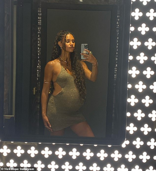 And the mother-to-be looked as sensational as ever while posing in the mirror in another snap