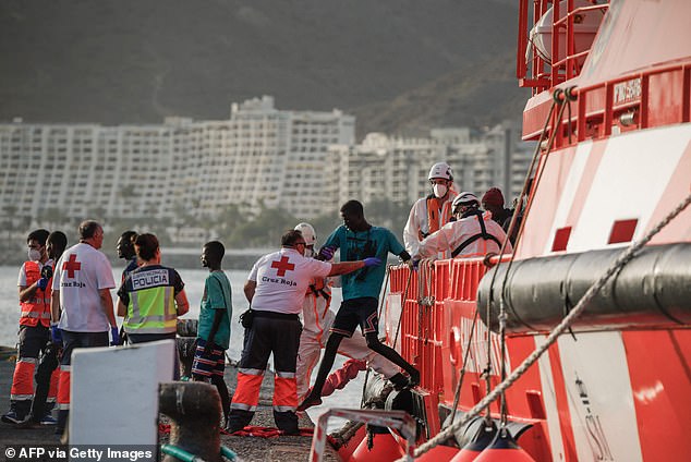 PICTURED: Migrants disembark from a Spanish Maritime Rescue vessel in the Port of Arguineguin on the Canary Island of Gran Canaria, on July 10, 2023