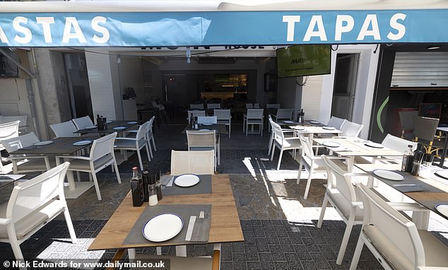 Families visiting the Balearic favourite are reluctant to pay 200 euros for a meal if they've already paid 5,000 euros for their holiday, said Carrió (Pictured: An empty restaurant in Alcudia this month)