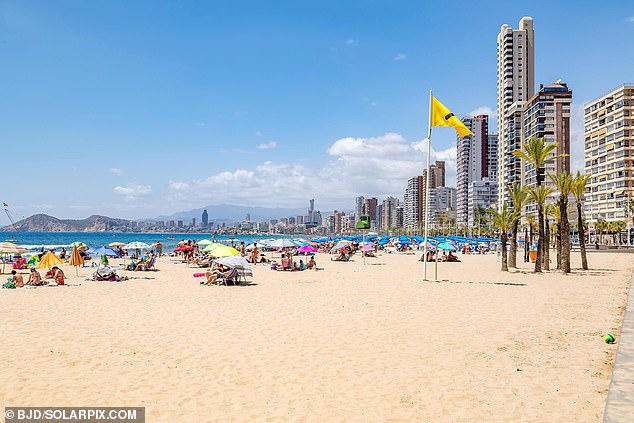 Pictured: Benidorm with unusually quiet bar terraces and some space on the local beaches
