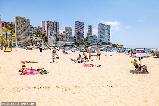 Pictured: A beach in Benidorm unusually quiet for this time of year