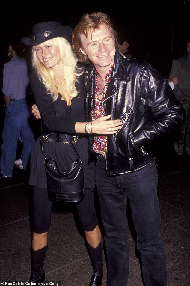 Dave Edmunds' wife Cici has given a major health update on the 70s rocker after he was left fighting for his life following terrifying cardiac arrest last week (the couple pictured in 1992)
