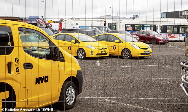 US flags have been erected on the sides of buildings while bright yellow taxis have been parked up in the city as the Hollywood production gets well underway