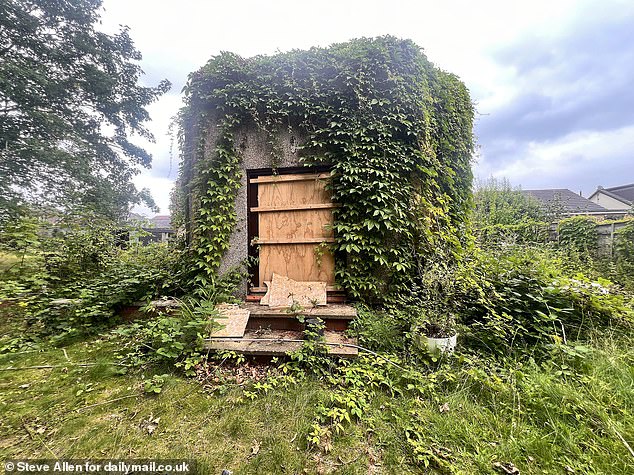 AFTER: An outhouse building is now barricaded with makeshift defences to deter youths