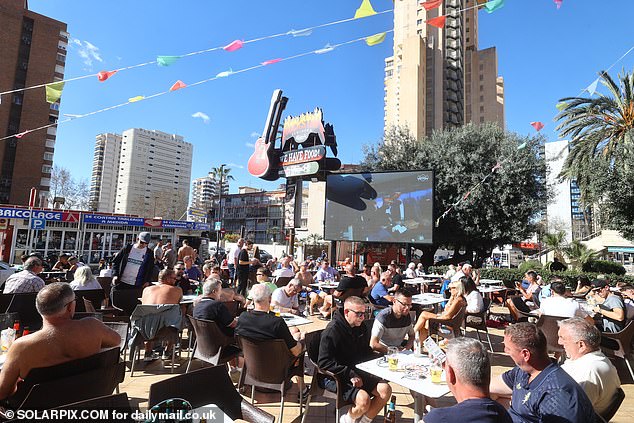 An image taken of the same bar sharply contrasts with scenes in March this year (pictured) when the same terrace was rammed with drinkers