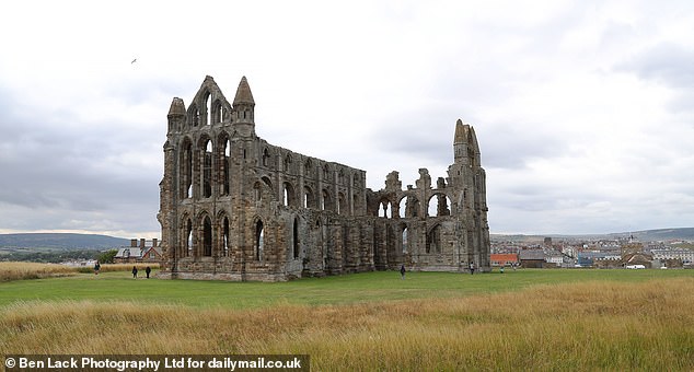 The area beside the historic 7th-century Abbey, which sits on the clifftop over the historic fishing port of Whitby, has been busy with people setting up for a vintage steam engine rally
