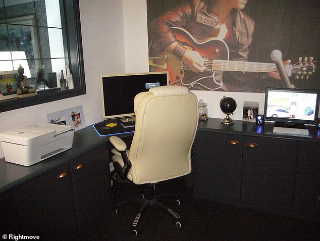 There is also a large blow up picture of the rock icon on the wall in the home's office