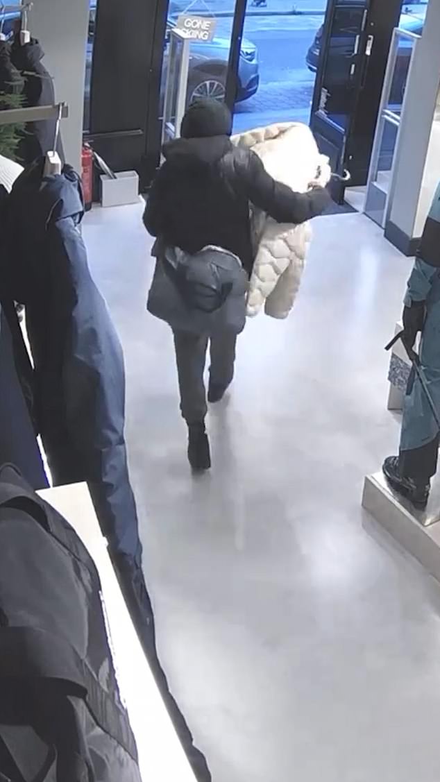 In another clip, a man with a bag calmly picks up a cream puffer jacket and exits the store without challenge