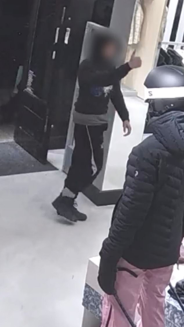 CCTV footage shared by the Met shows a hooded man casually giving staff a thumbs up before pulling a clothes stand