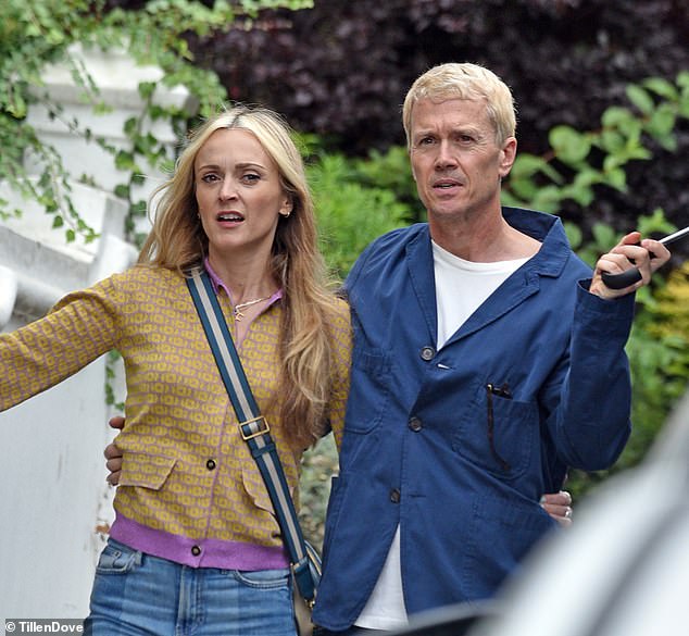 The loved up pair were pictured with their arms around each other as they took a romantic stroll through the streets of Richmond
