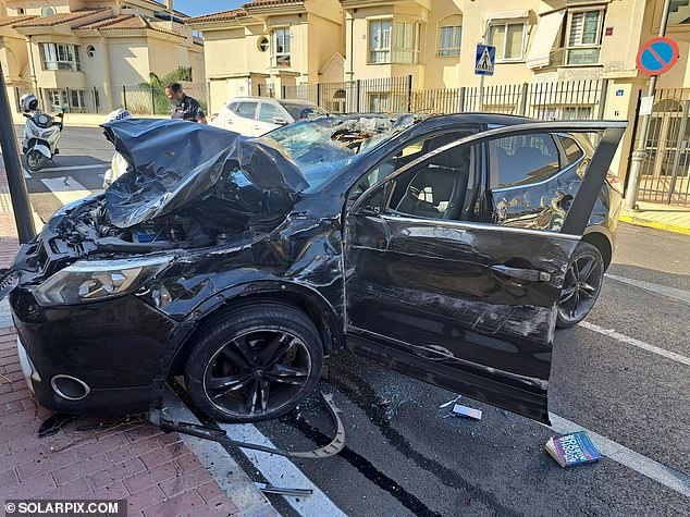 A fugitive Brit believed to be a hitman who police say was wanted for murder has been arrested after a run-in with two women at a Costa del Sol petrol station and a subsequent car crash (pictured)