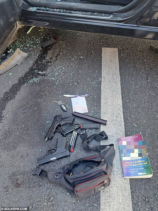 The pics showed the unnamed Brit was carrying pistols, ammunition and a silencer - as well as a copy of a book called 'Practical Buddhism and the Search for Self'