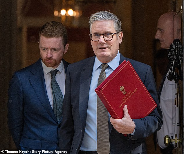 Prime Minister Keir Starmer is seen leaving 10 Downing Street in London with his chief of staff, Morgan McSweeney