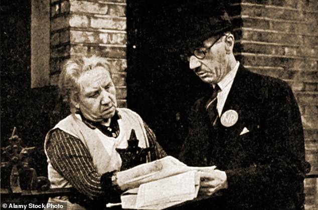 A system of identity cards was originally introduced in September 1939 under the National Registration Act - but it was repealed in May 1952. Pictured: An enumerator visits a household in the UK to deliver a compulsory registration form to a householder