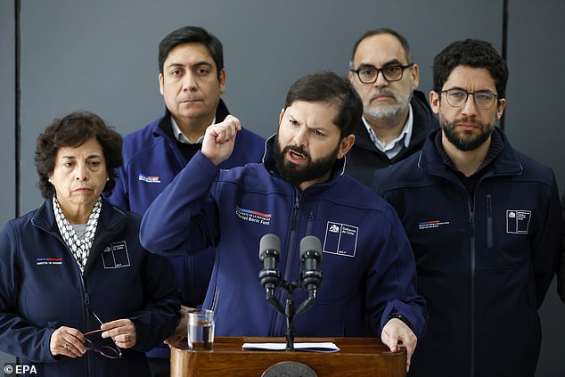 Chilean President Gabriel Boric (C) speaks alongside Mining Minister Aurora Williams (L) and other officials during a press conference at the El Teniente Division headquarters in Rancagua, Chile, August 2, 2025