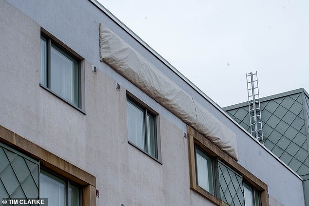 Another attempt to banish the hotel's former identity saw a huge tarpaulin draped over a logo at the top of the building