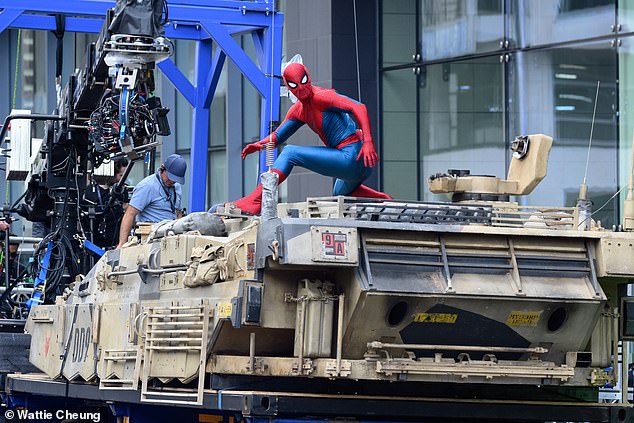 The actor was seen filming scenes for the upcoming film in his full Spider-Man suit on top of a tank