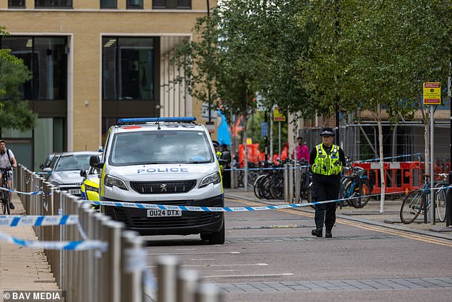 Police at the scene in Cambridge where a male student, 20, was found dead on Friday evening