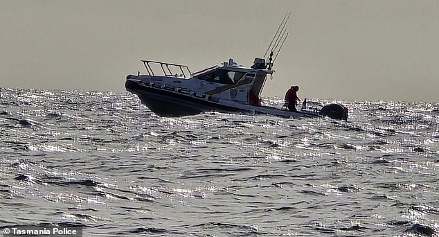 Authorities are still searching for a man and woman in their 70s and 60s after a light aircraft vanished (above, a Tasmania Police boat)