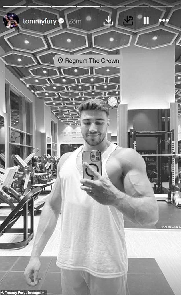 Tommy beamed for a black and white selfie as he hit the hotel gym