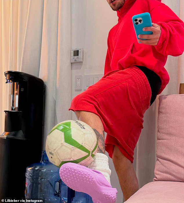 He showed off the purple shoes while also flaunting his soccer skills by kicking the ball in both a snap and a short clip
