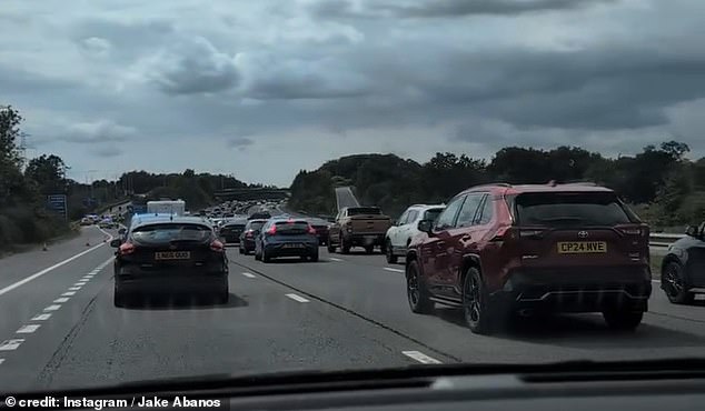 A queue of drivers visibly slows down on their approach to the scene in Cardiff between junction 32 and junction 33 westbound heading to Capel Llanilltern