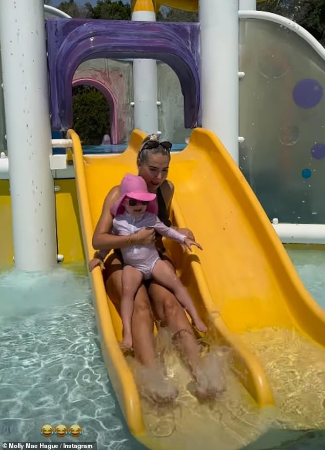 Bikini-clad Molly was seen beaming as Bambi sat on her lap while going down a small water slide, at the Aqualantis which also includes a number of water slides and lazy rivers