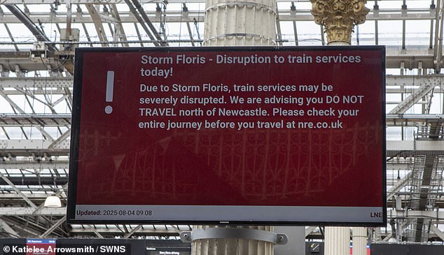 A sign at Edinburgh train station warns commuters about disruption due to Storm Floris