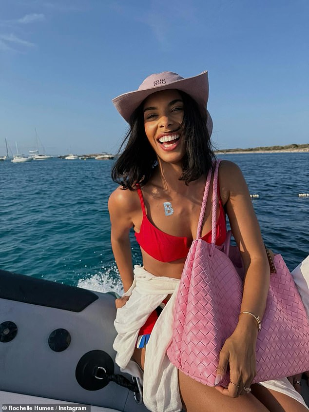 Rochelle flashed her washboard abs in a sizzling red bikini during a fun-filled boat trip on the island